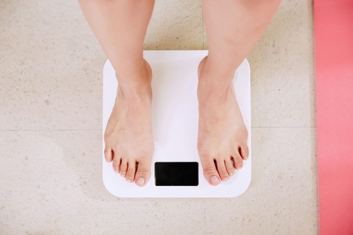 person standing on weight scale